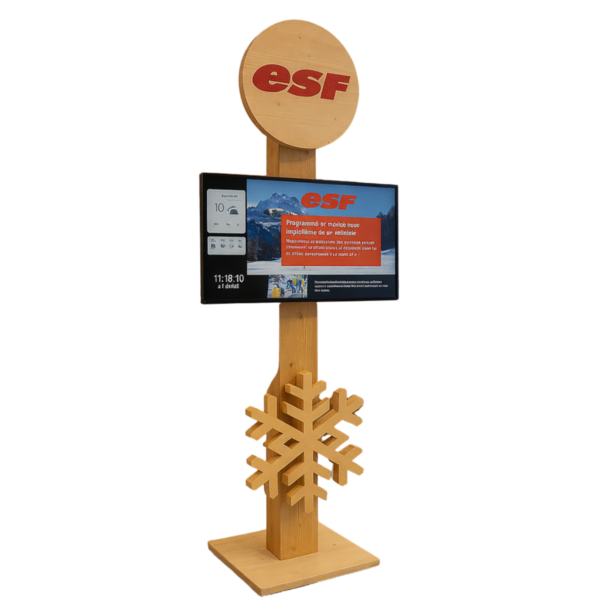 Wooden ESF information stand with a circular logo at the top, a mounted display panel, and a decorative wooden snowflake on the pole.